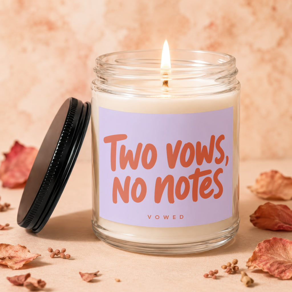 Candle with "Two vows, no notes. VOWED" text on a lavender label.