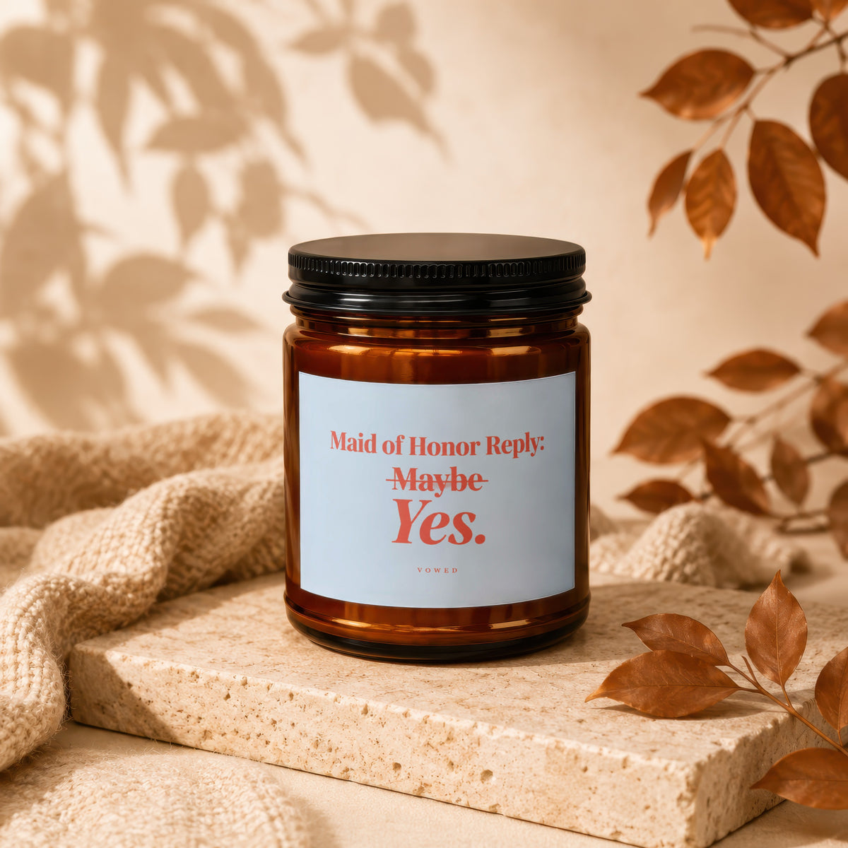 Amber jar candle with "Maid of Honor Reply: Maybe Yes." text, VOWED.