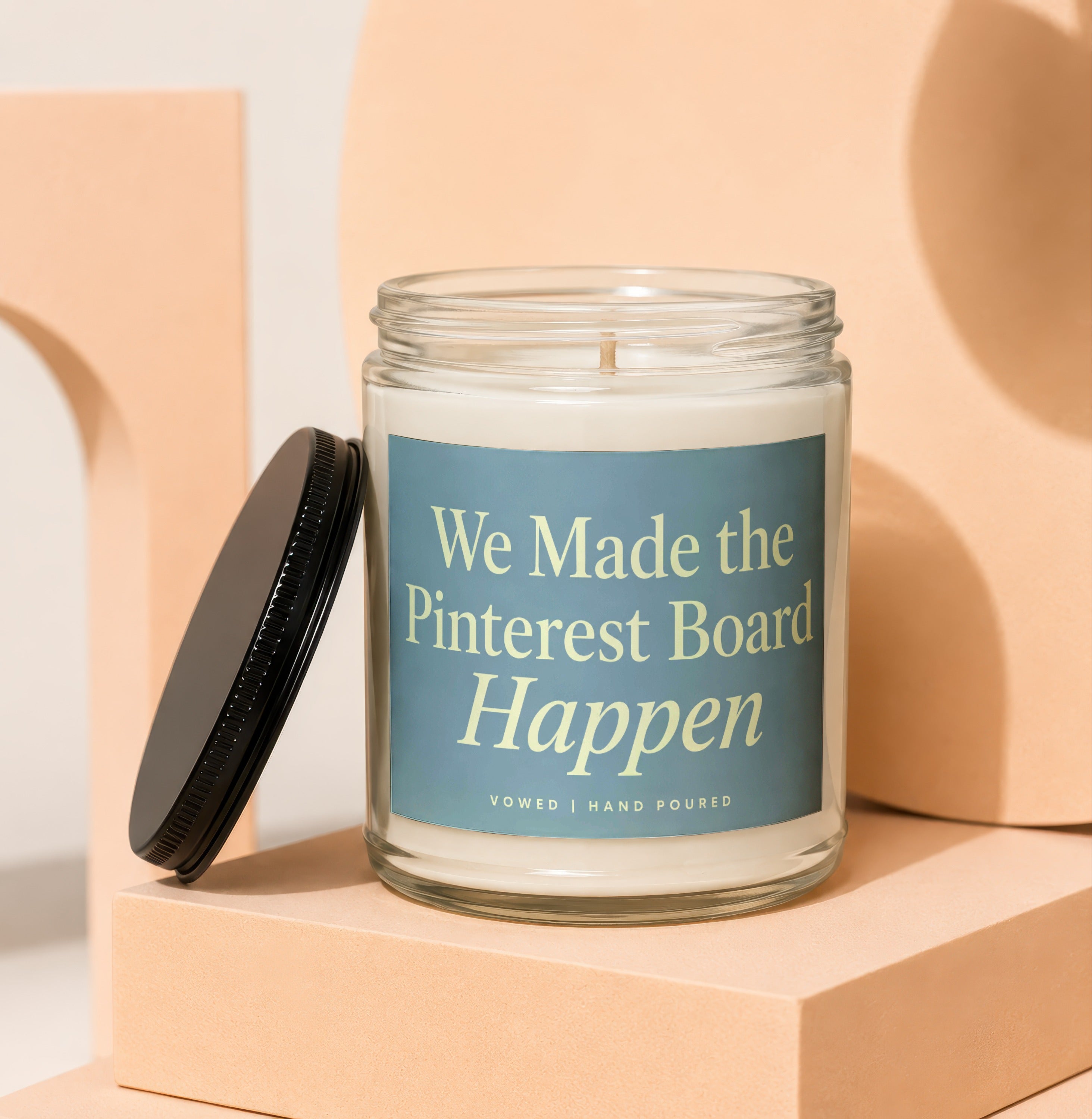 Glass candle with label reading "We Made the Pinterest Board Happen".