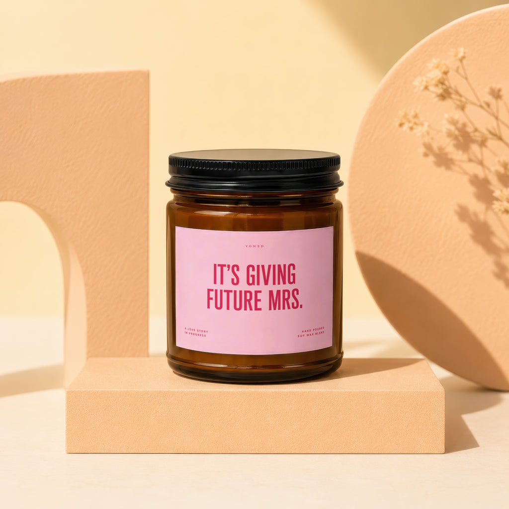 Vowed candle with pink label reading "IT'S GIVING FUTURE MRS."