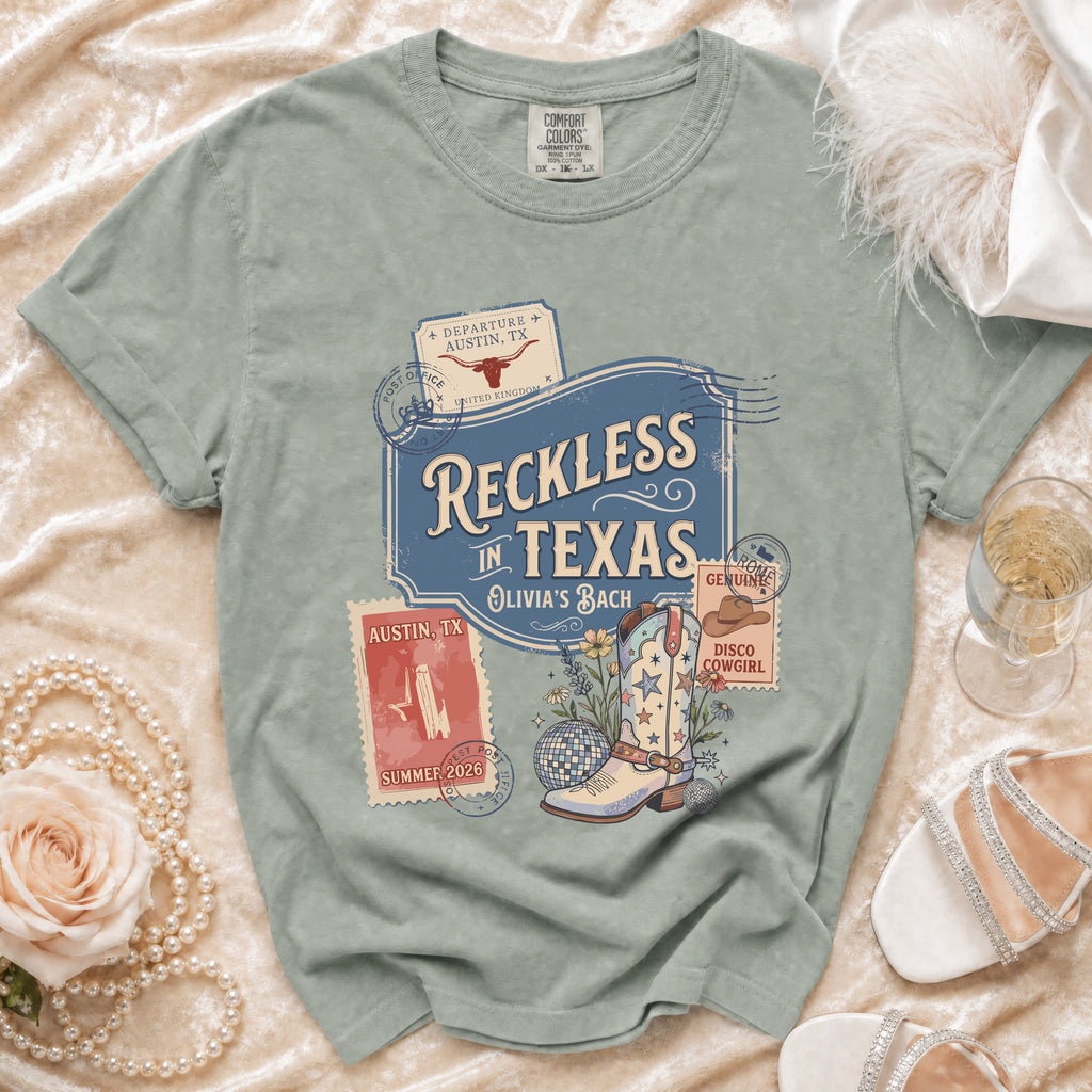 Comfort Colors t-shirt with "Reckless in Texas" and boot graphic.