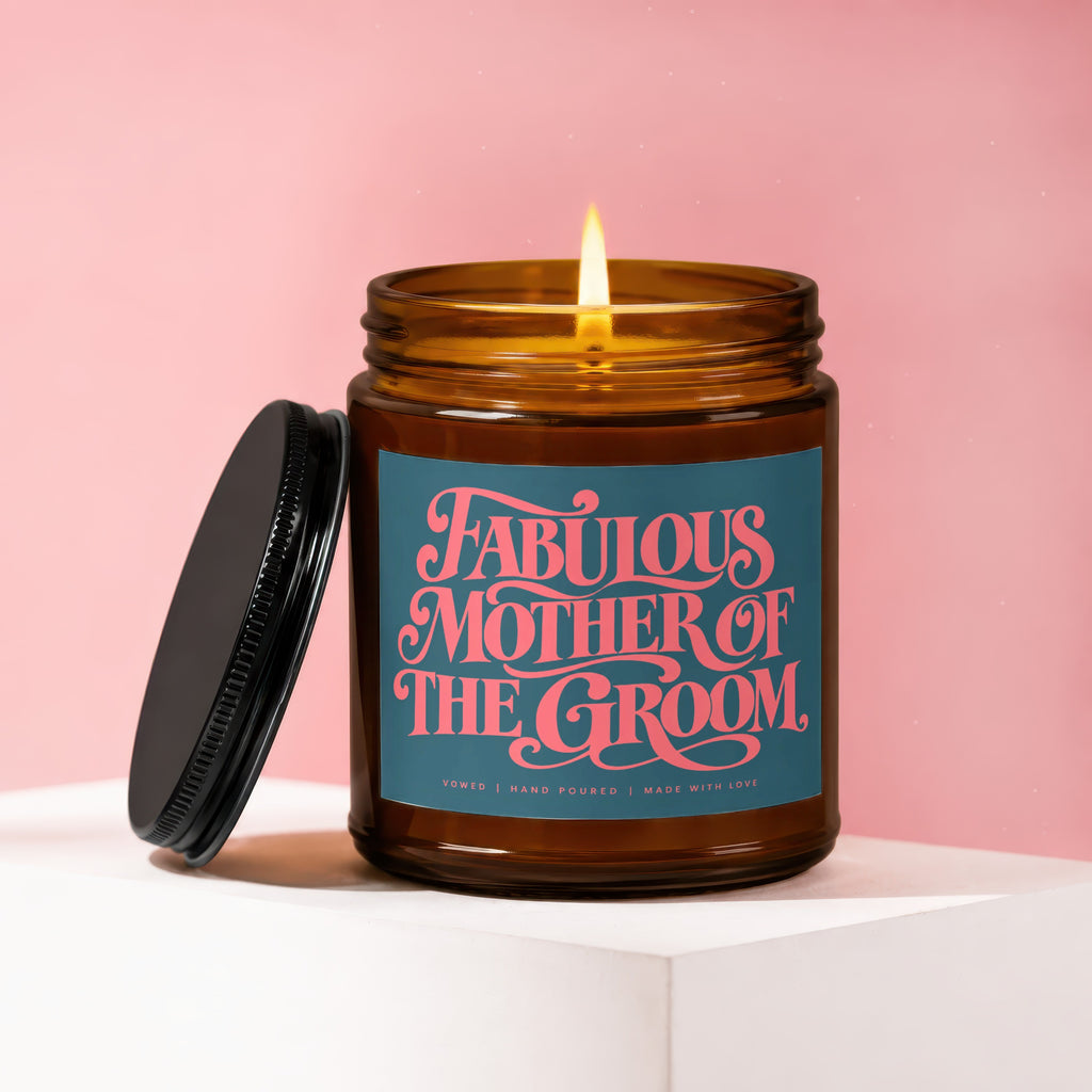 Amber glass candle with lit flame and "Fabulous Mother of The Groom" label.