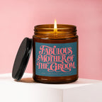 Amber glass candle with lit flame and "Fabulous Mother of The Groom" label.