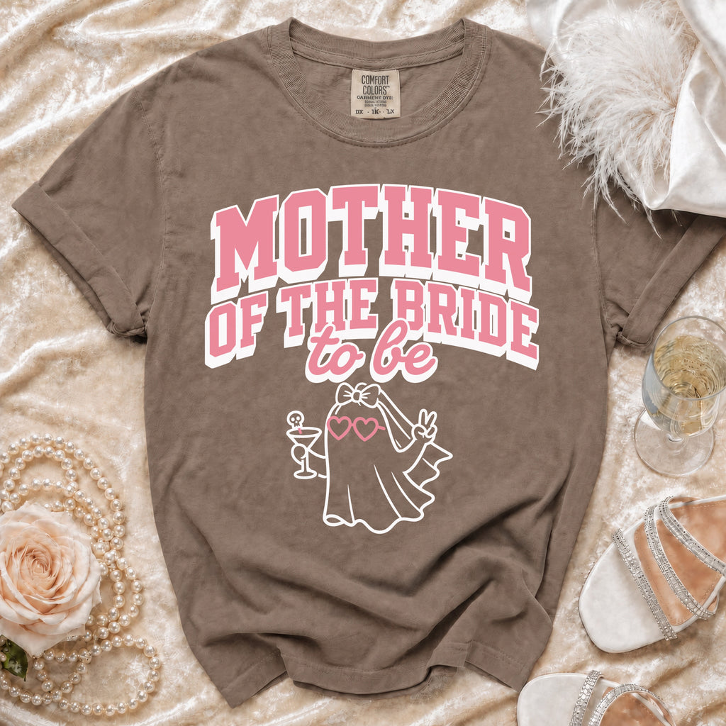 Brown t-shirt with pink text "MOTHER OF THE BRIDE to be" and a ghost graphic.