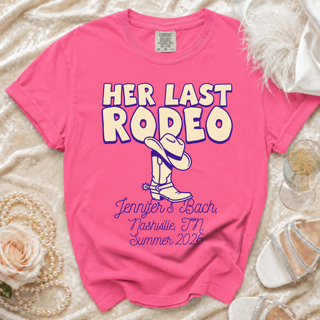Pink t-shirt with "Her Last Rodeo" text, cowboy boot, and event details.