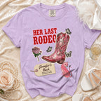 Purple t-shirt with "Her Last Rodeo" and boot graphic, Nashville bachelorette text.