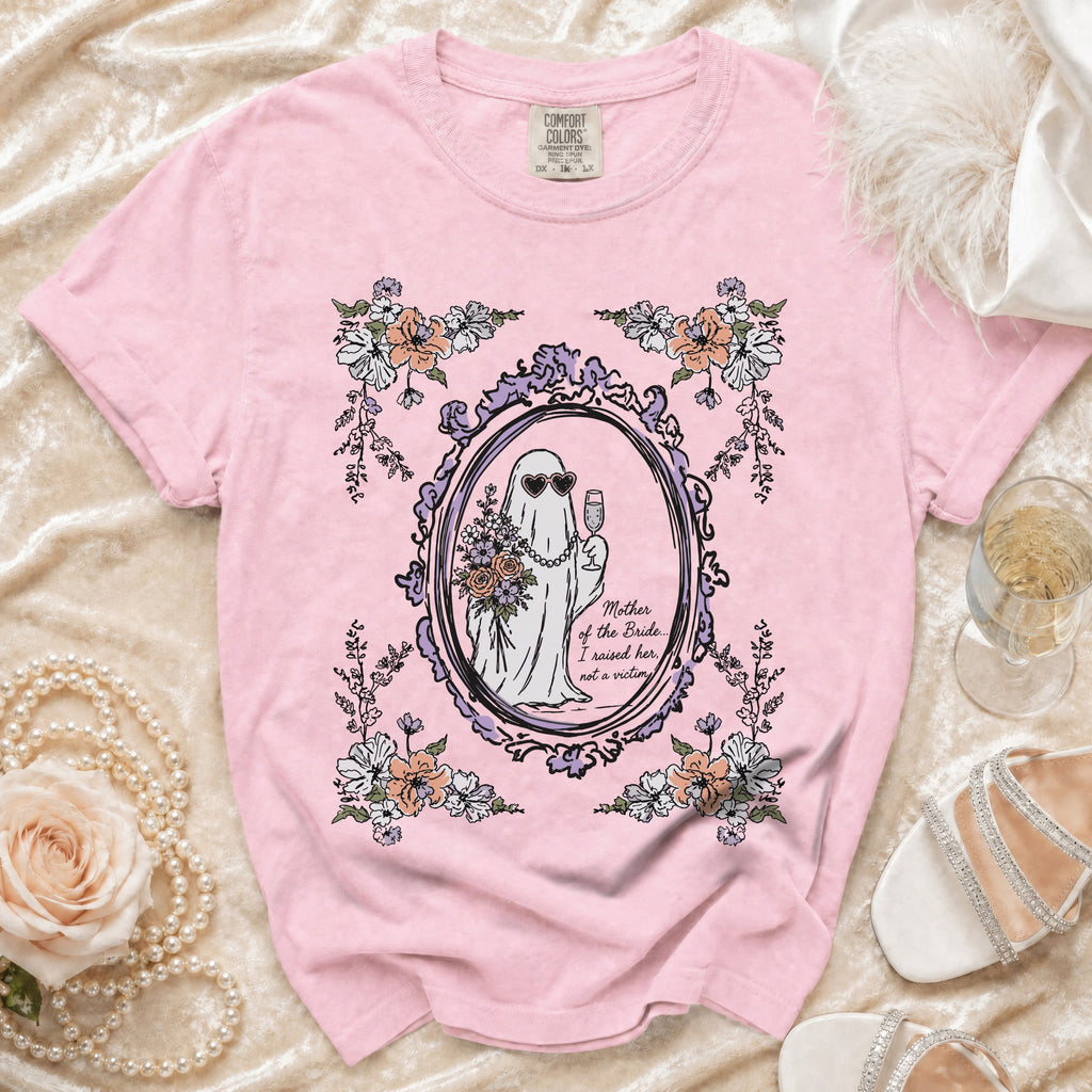 Pink t-shirt with a ghost bride graphic and text "Mother of the Bride... I raised her, not a victim."