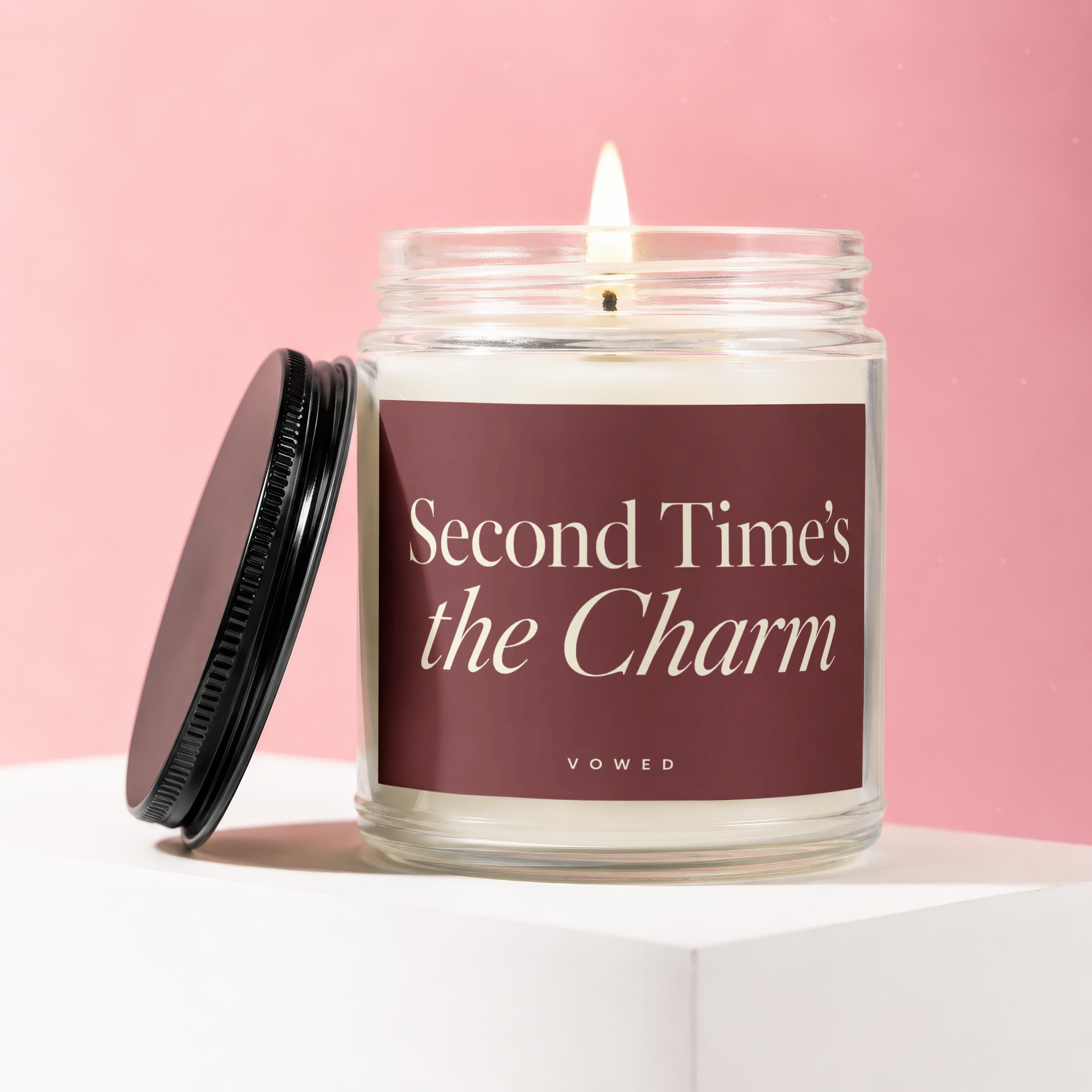 Candle with burgundy label reading "Second Time's the Charm" by Vowed.