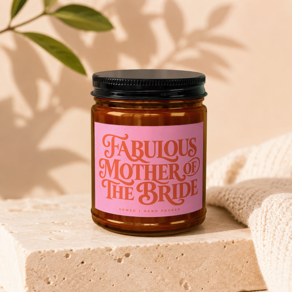 Candle with "Fabulous Mother of the Bride" text on a pink label.