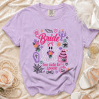 Purple t-shirt with "Bride too cute to spook" Halloween ghost graphic and decorations.