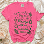 Pink t-shirt with cowboy hat, boots, cacti, horseshoes, and "Her Last Rodeo" text.