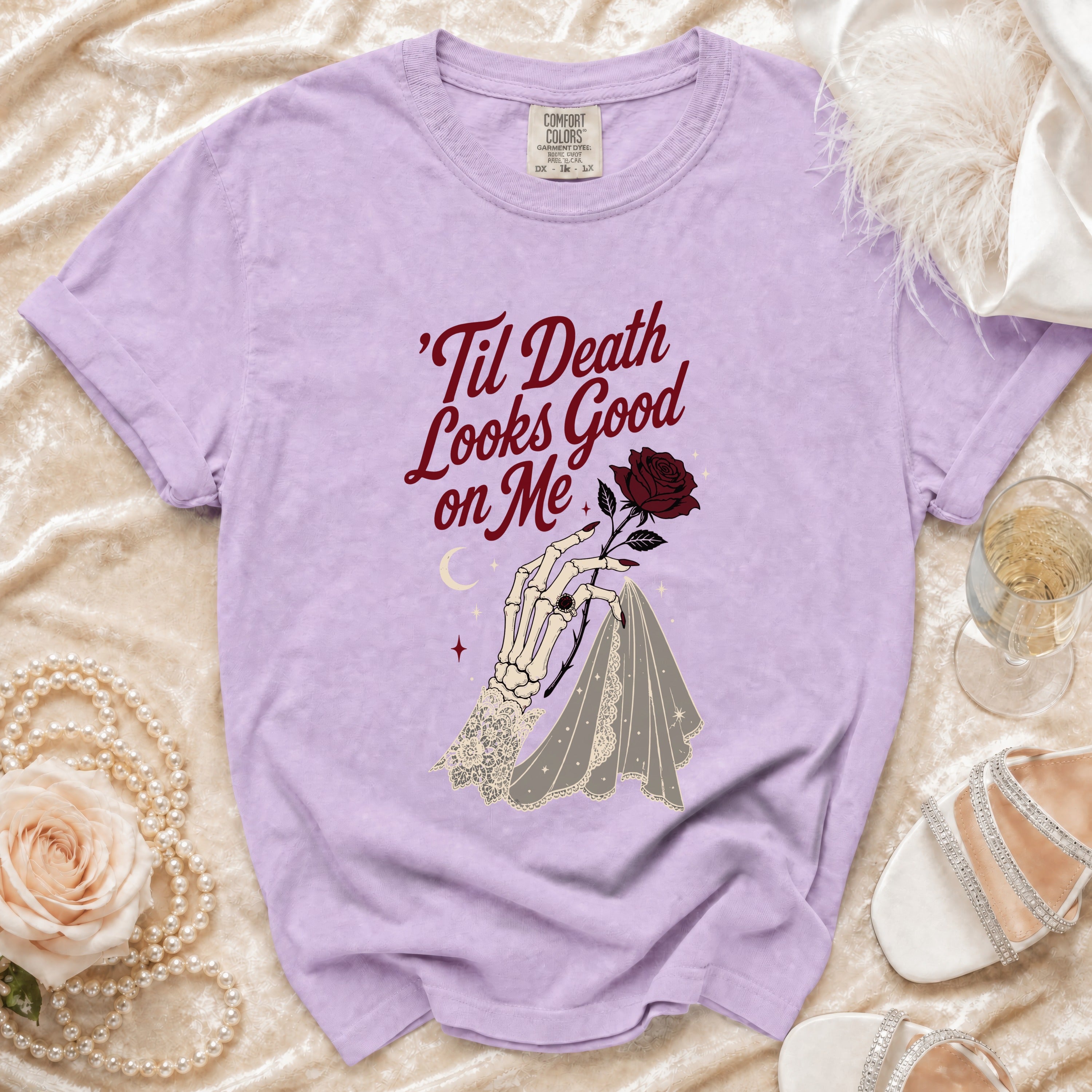 Lavender t-shirt with skeletal hand holding a rose and veil, text reads 'Til Death Looks Good on Me.