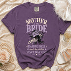 Purple crewneck t-shirt with Mother of the Bride text and a skeleton hand holding a bouquet.