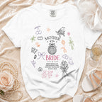 White t-shirt with "Mother of the Bride" and wedding-themed doodles.