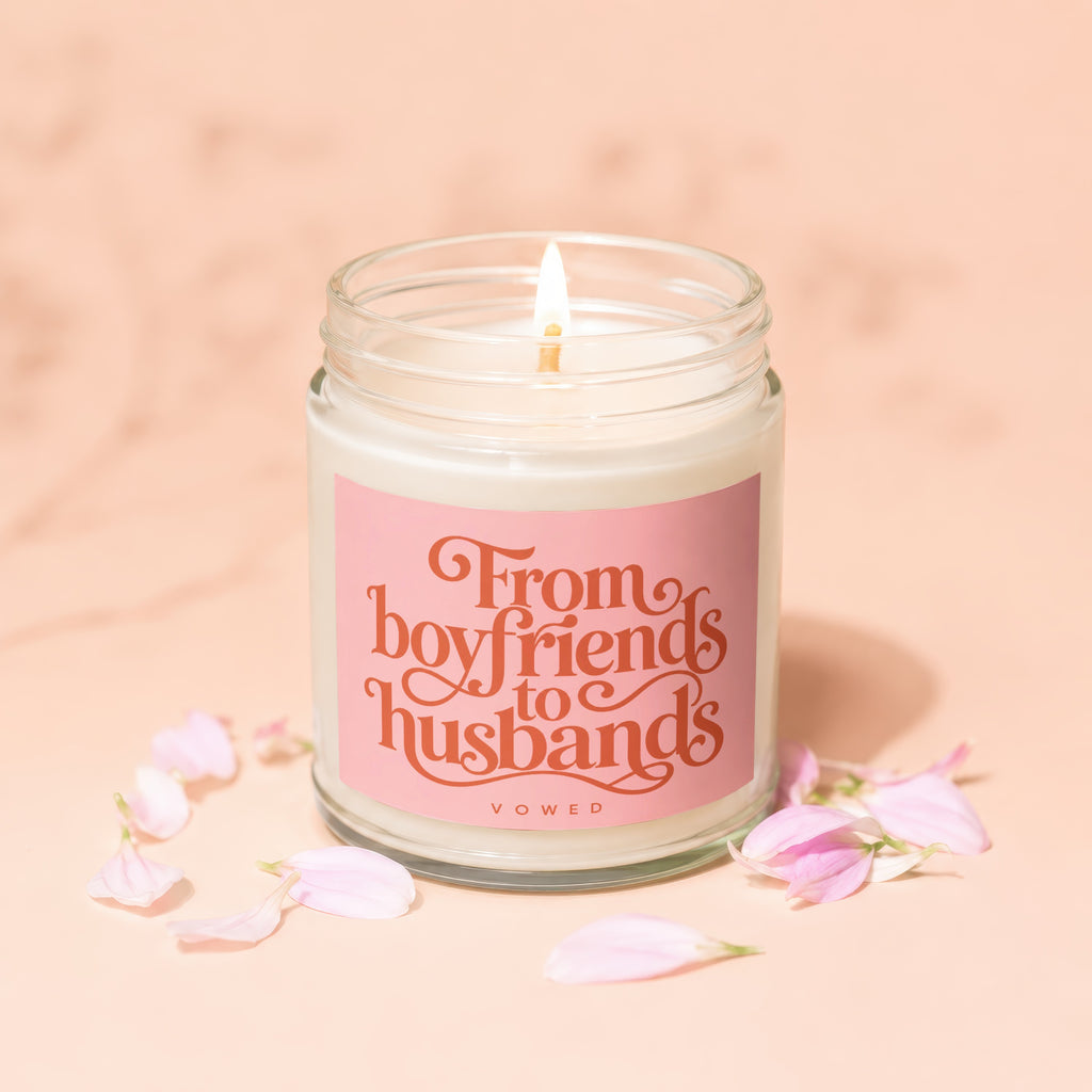 Jar candle with pink label reading "From boyfriends to husbands" and "VOWED".