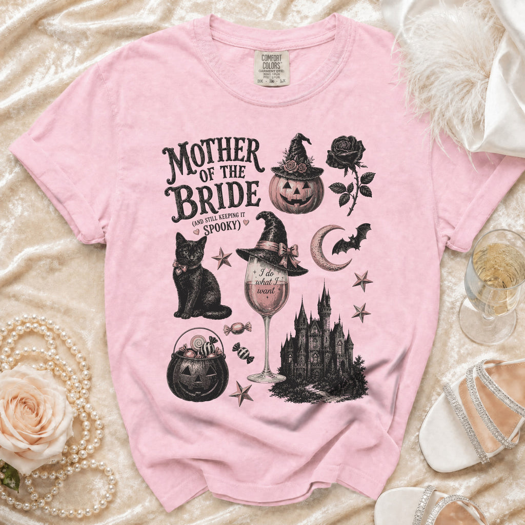 Pink t-shirt with "Mother of the Bride (and still keeping it spooky)" Halloween graphic.