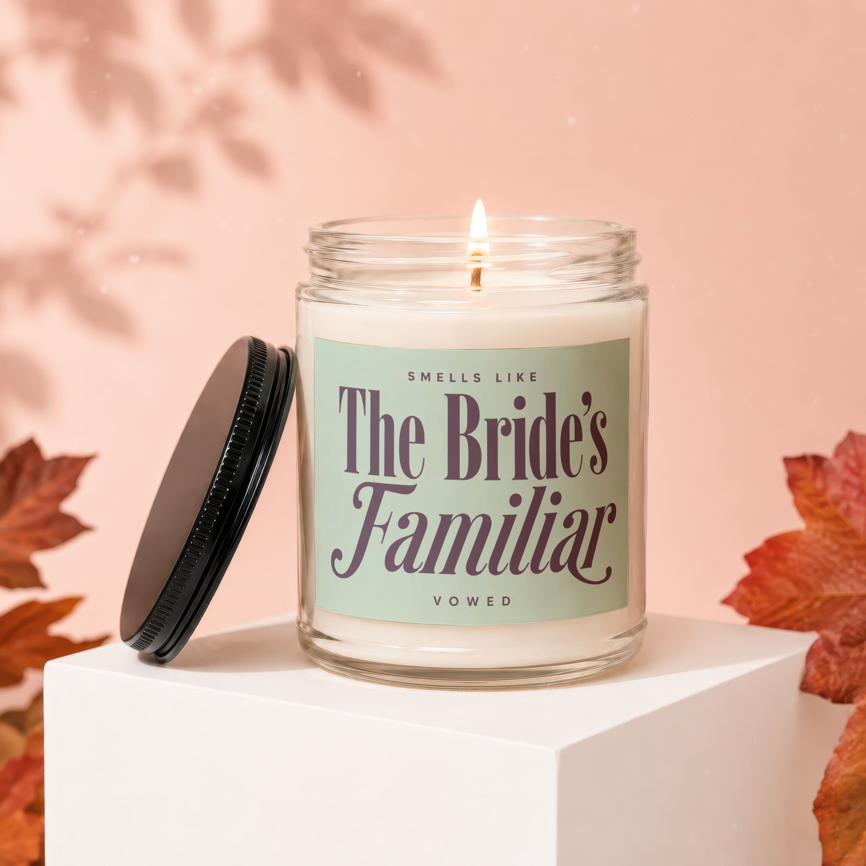 Candle with "The Bride's Familiar" text on label, lid off.