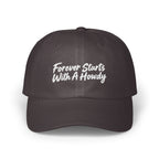 Dark grey baseball cap with white embroidered text reading Forever Starts With A Howdy centered on the front.