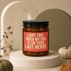 Amber jar candle with red label reading "Light this when my son is on your last nerve."