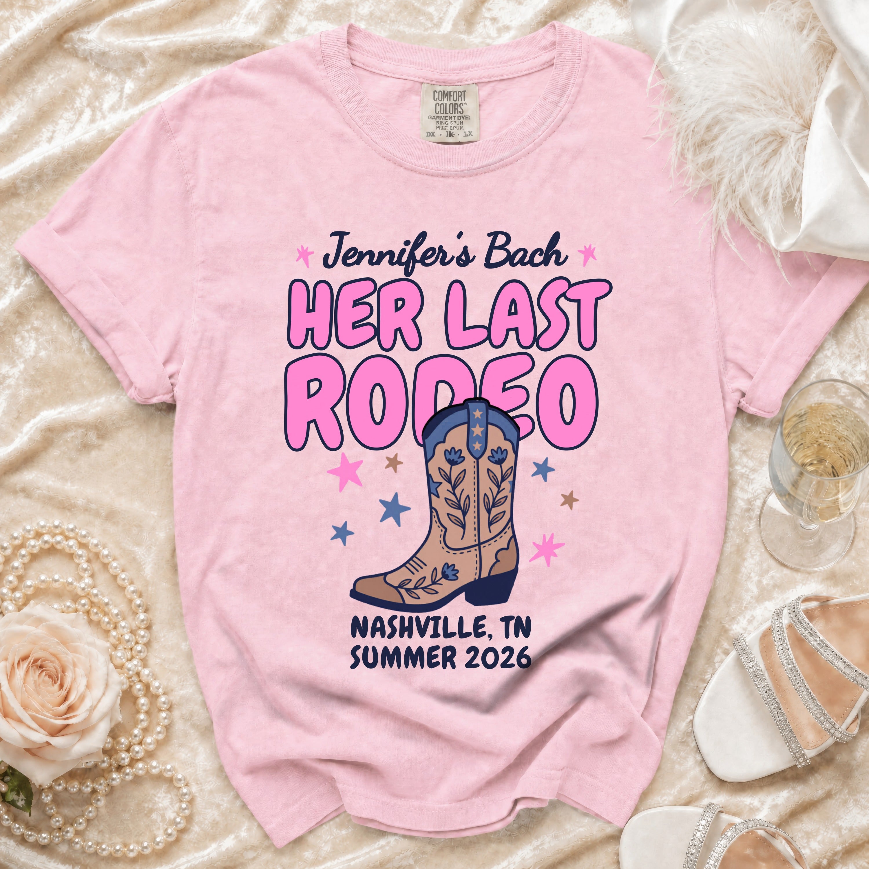 Pink t-shirt with "Jennifer's Bach Her Last Rodeo Nashville, TN Summer 2026" text.