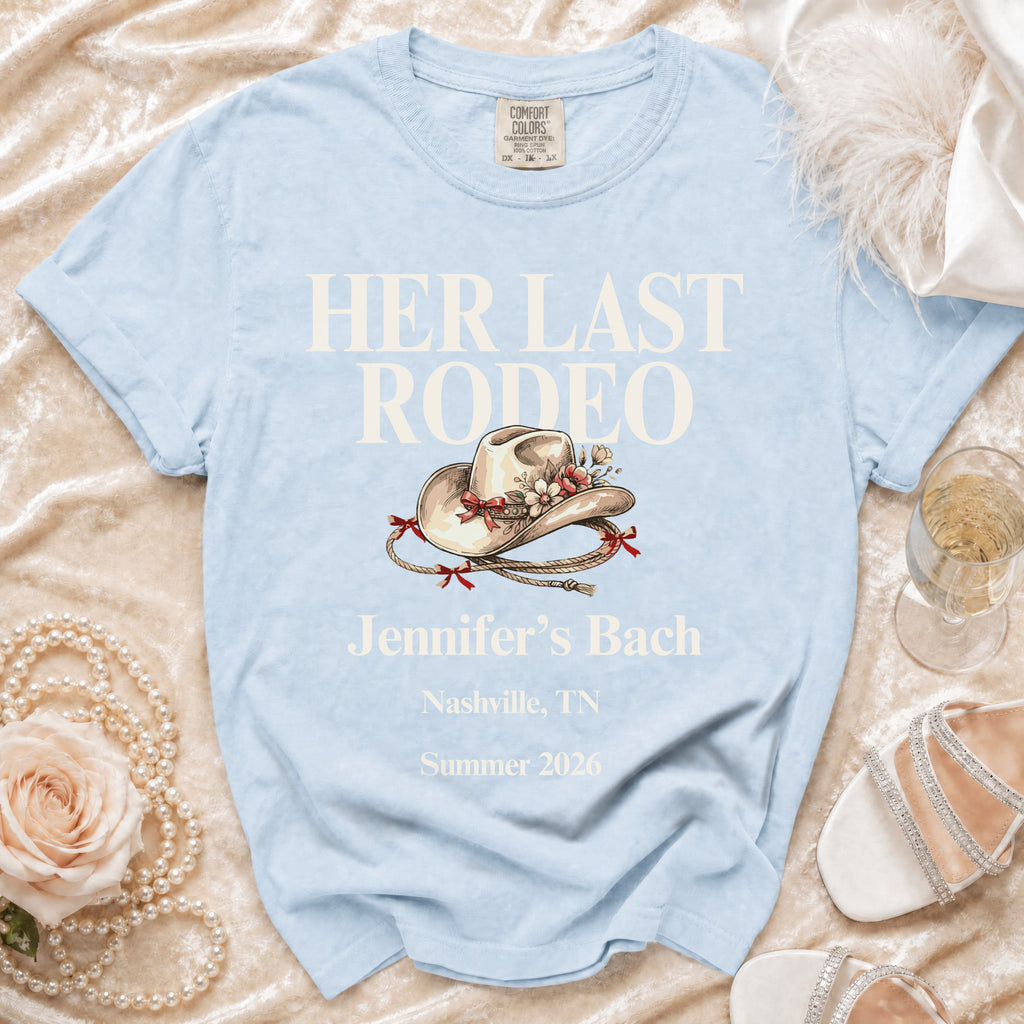 Light blue "Her Last Rodeo" t-shirt with cowboy hat graphic for Jennifer's Bach.