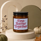 Amber candle with white label reading "Fine Better Together" and "vowed".