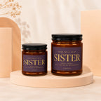 Two brown glass jars with black lids feature purple labels reading "Sister" and "Will you be my bridesmaid?".