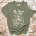 Green t-shirt with "This Bride Bites" text, vampire bride, and gothic graphics.