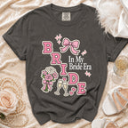 Dark grey t-shirt with "BRIDE" and "In My Bride Era" text and graphics.