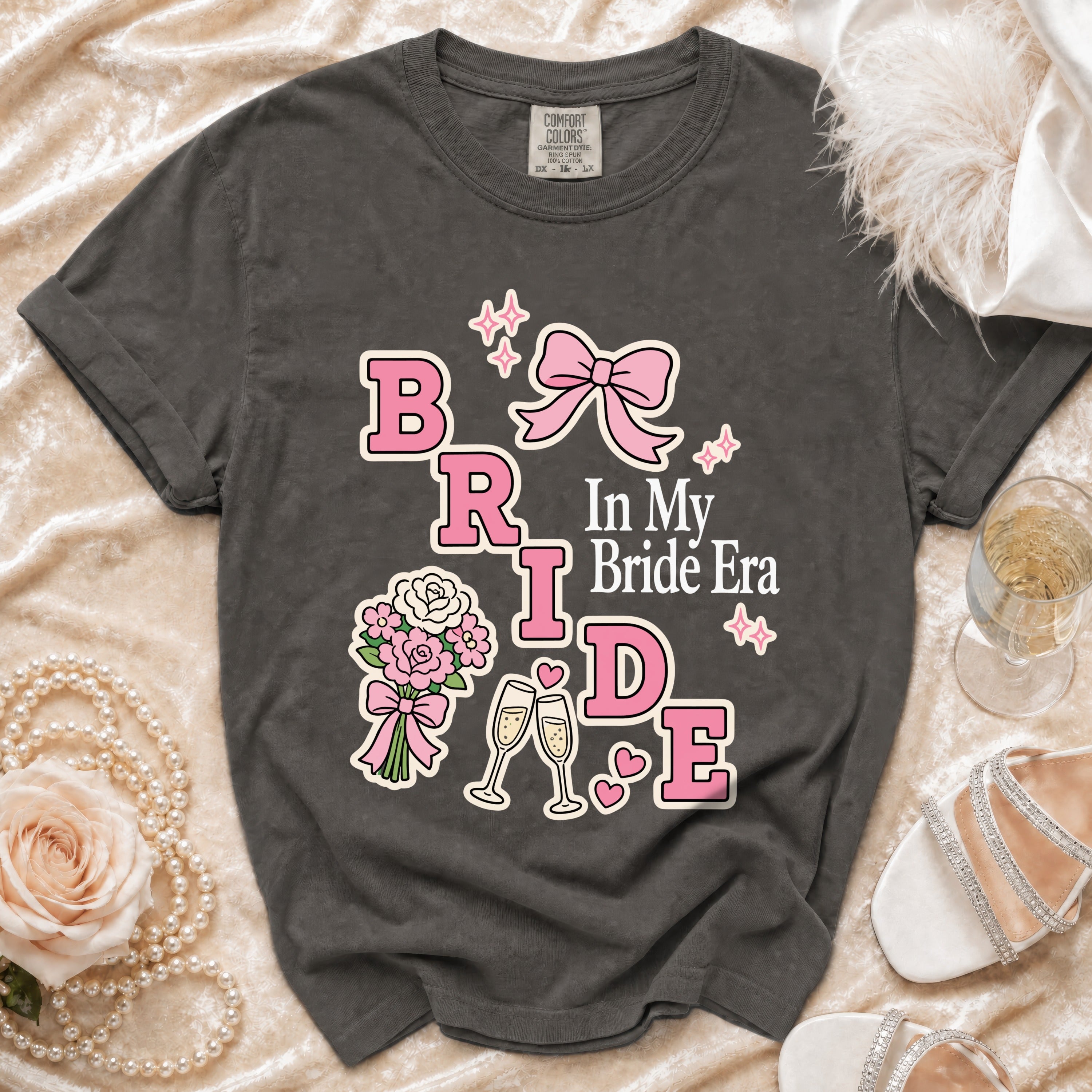 Dark grey t-shirt with "BRIDE" and "In My Bride Era" text and graphics.