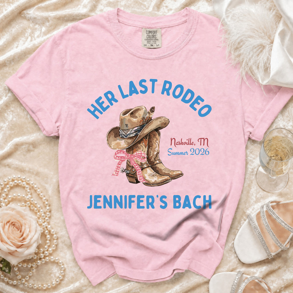 Pink t-shirt with "Her Last Rodeo" text, cowboy hat, boots, and wedding details.