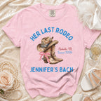 Pink t-shirt with "Her Last Rodeo" text, cowboy hat, boots, and wedding details.
