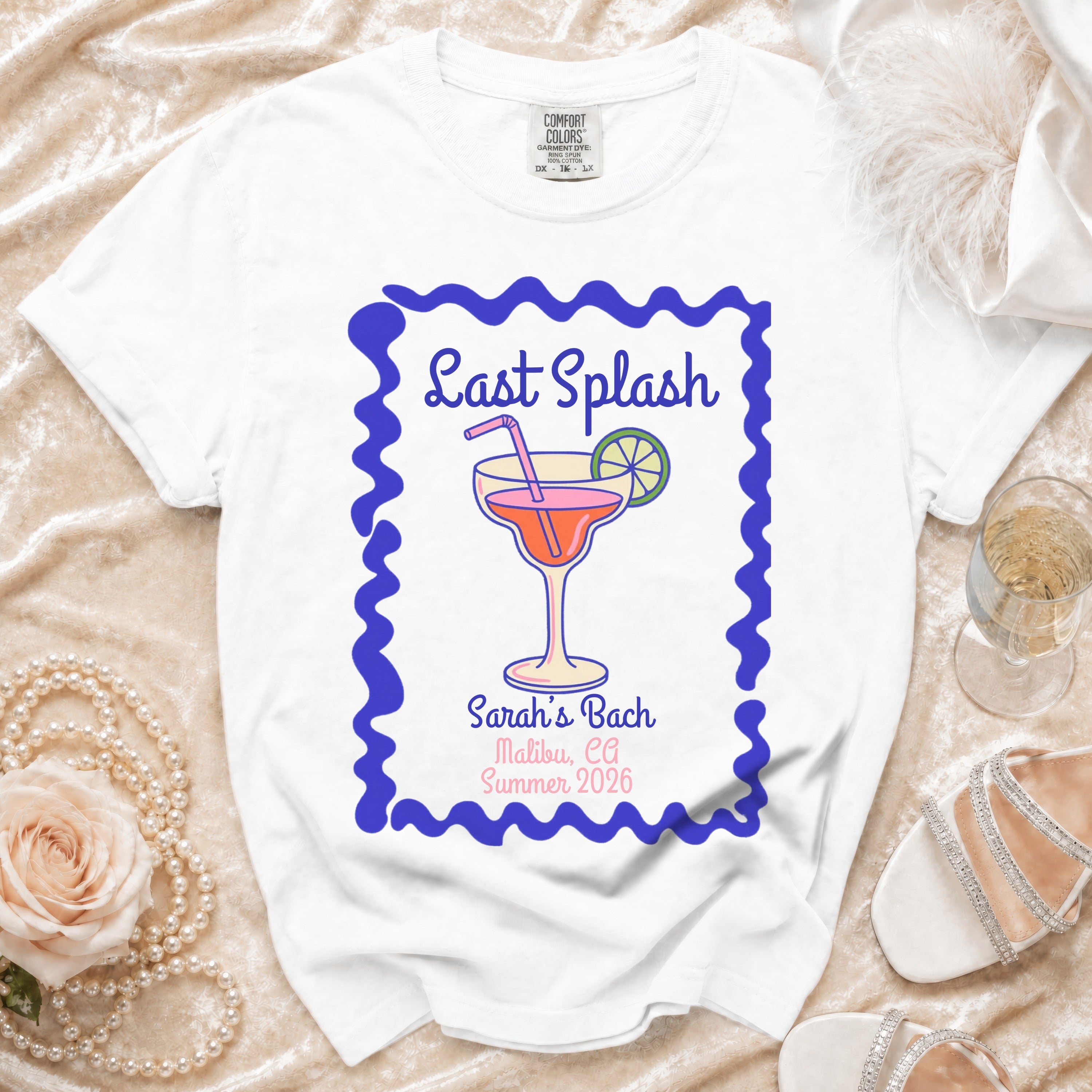 White t-shirt with "Last Splash" and Sarah's Bach details.