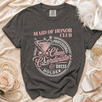 Dark gray t-shirt with "Maid of Honor Club Chaos Coordinator & Dress Holder" graphic.
