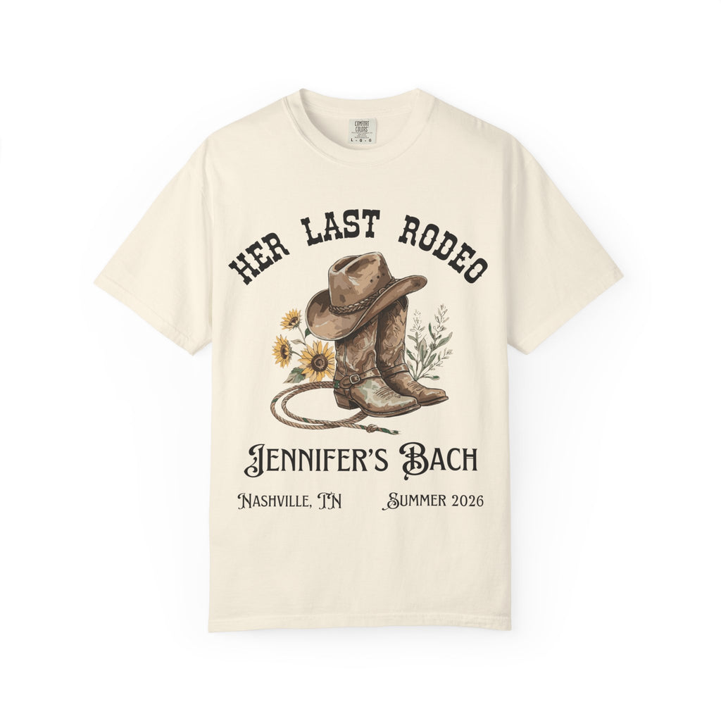 Cream t-shirt with cowboy boots, hat, rope, and "Her Last Rodeo" text.