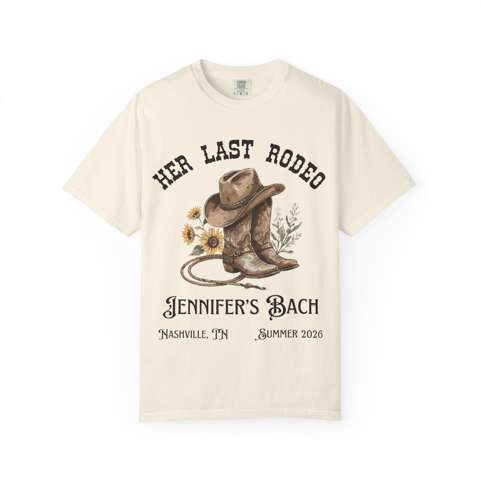 Cream t-shirt with cowboy boots, hat, rope, and "Her Last Rodeo" text.