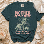 Dark teal t-shirt with "Mother of the Bride" and skeleton graphic.