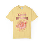Yellow t-shirt with "Sarah's Last Splash" text and flamingo drink graphic.