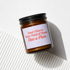 Amber candle in jar with black lid, "Don't Worry, Your Maid of Honor Has a Plan." text.