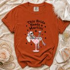 Orange t-shirt with text "This Bride Needs a Martini" and skeleton graphic.