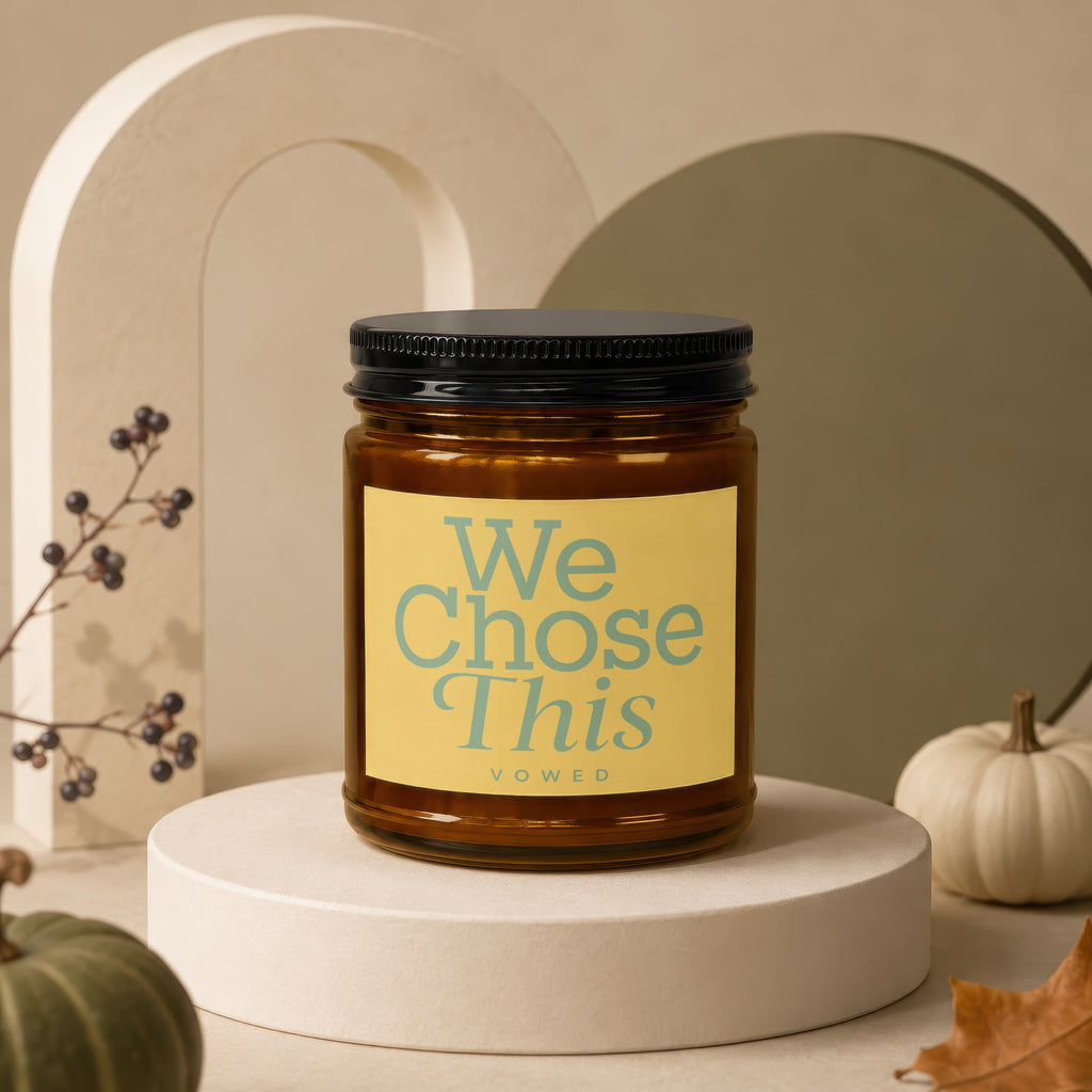 Amber candle with label reading "We Chose This vowed".