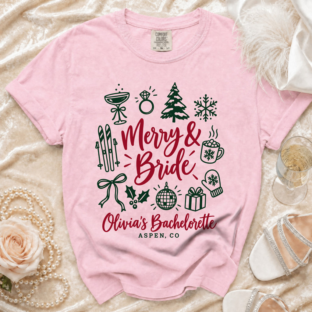 Pink t-shirt with "Merry & Bride Olivia's Bachelorette Aspen, CO" text and icons.