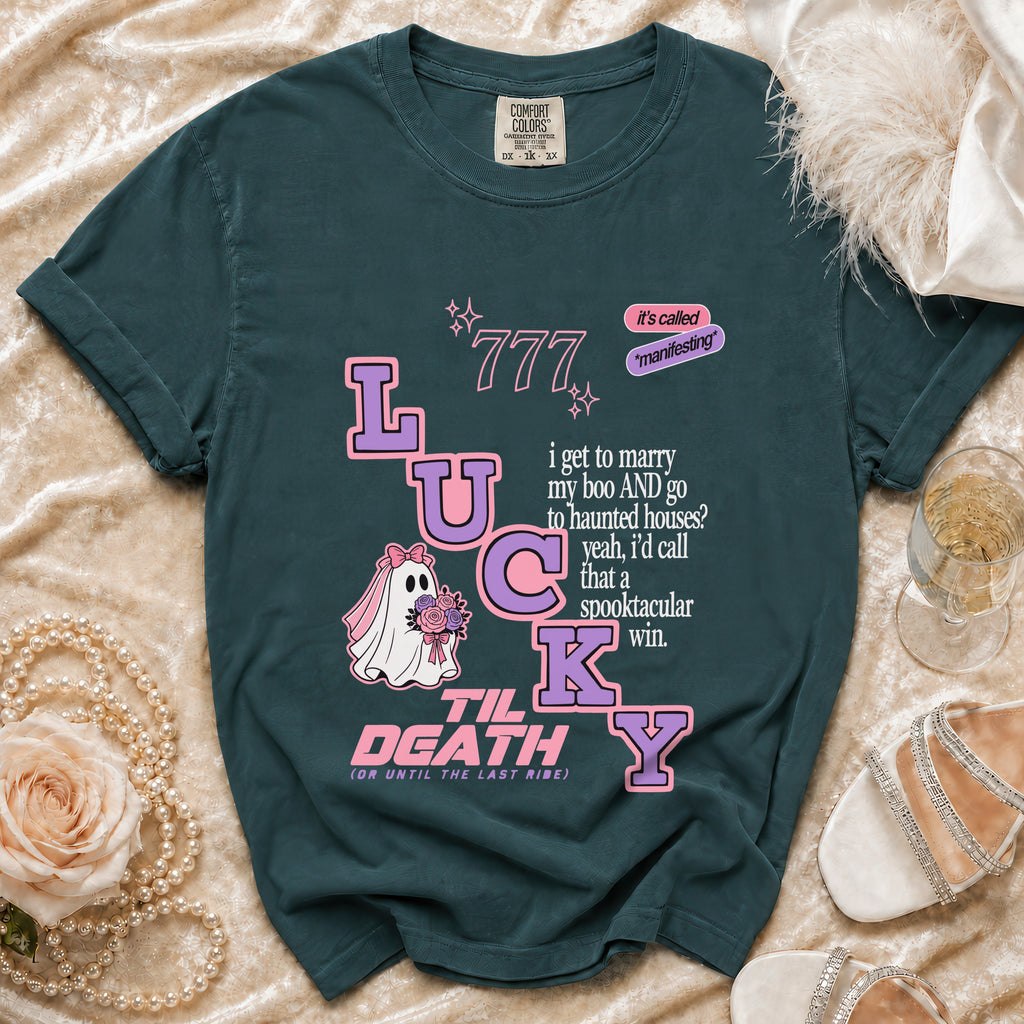 Teal t-shirt with "Lucky Til Death" design featuring a ghost bride and wedding text.