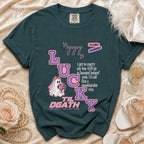 Teal t-shirt with "Lucky Til Death" design featuring a ghost bride and wedding text.