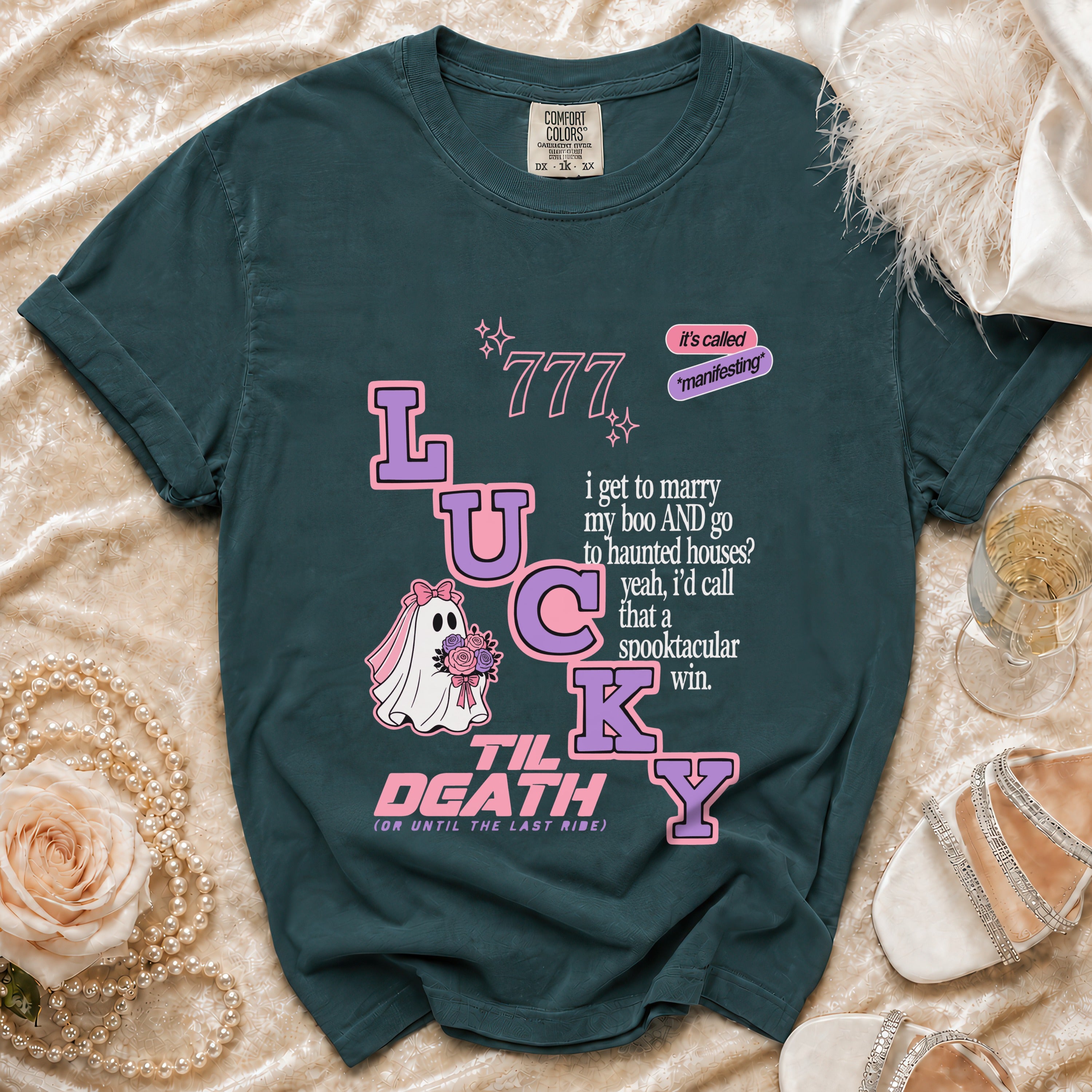 Teal t-shirt with "Lucky Til Death" design featuring a ghost bride and wedding text.