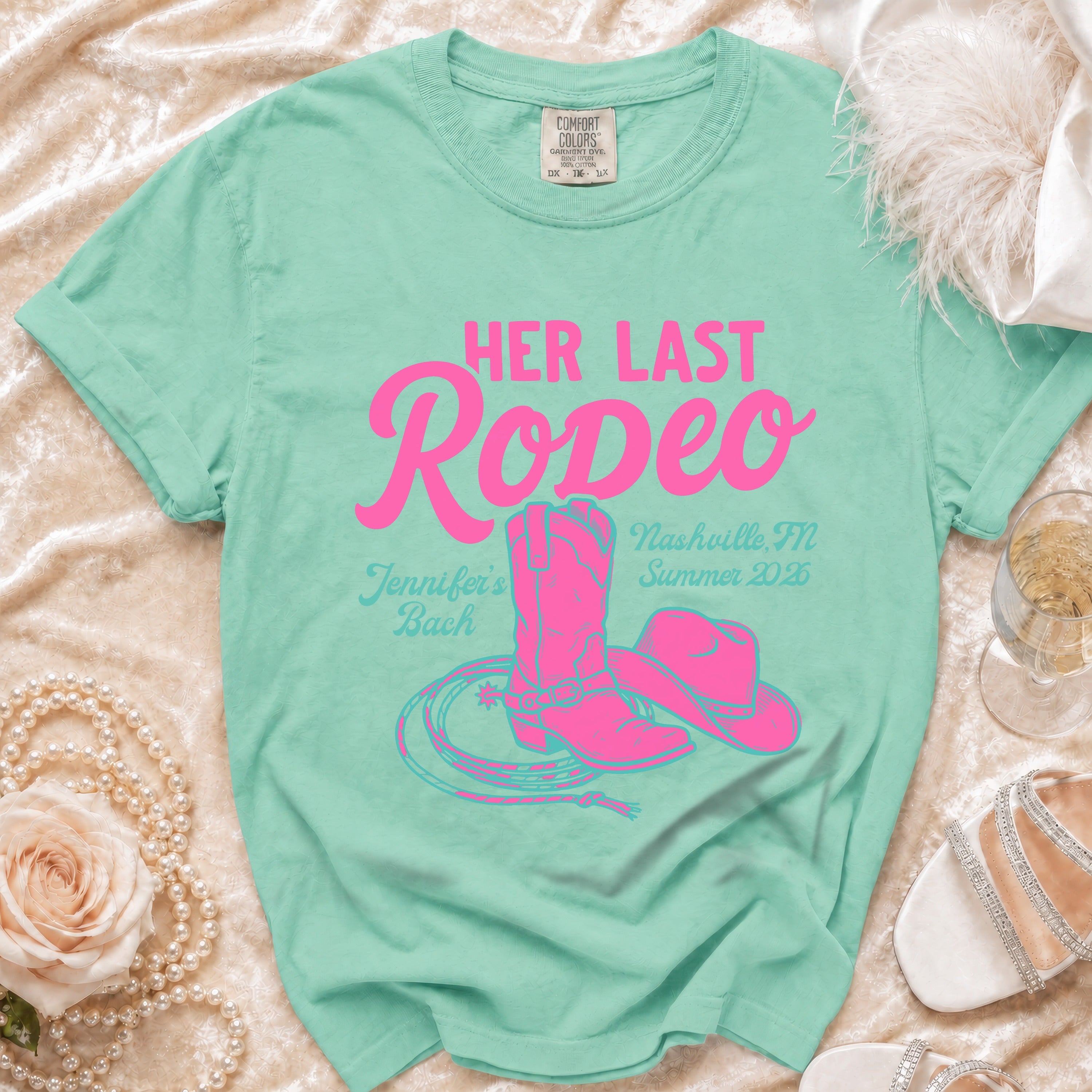 Aqua t-shirt with "Her Last Rodeo" and "Jennifer's Bach Nashville TN Summer 2026" text.