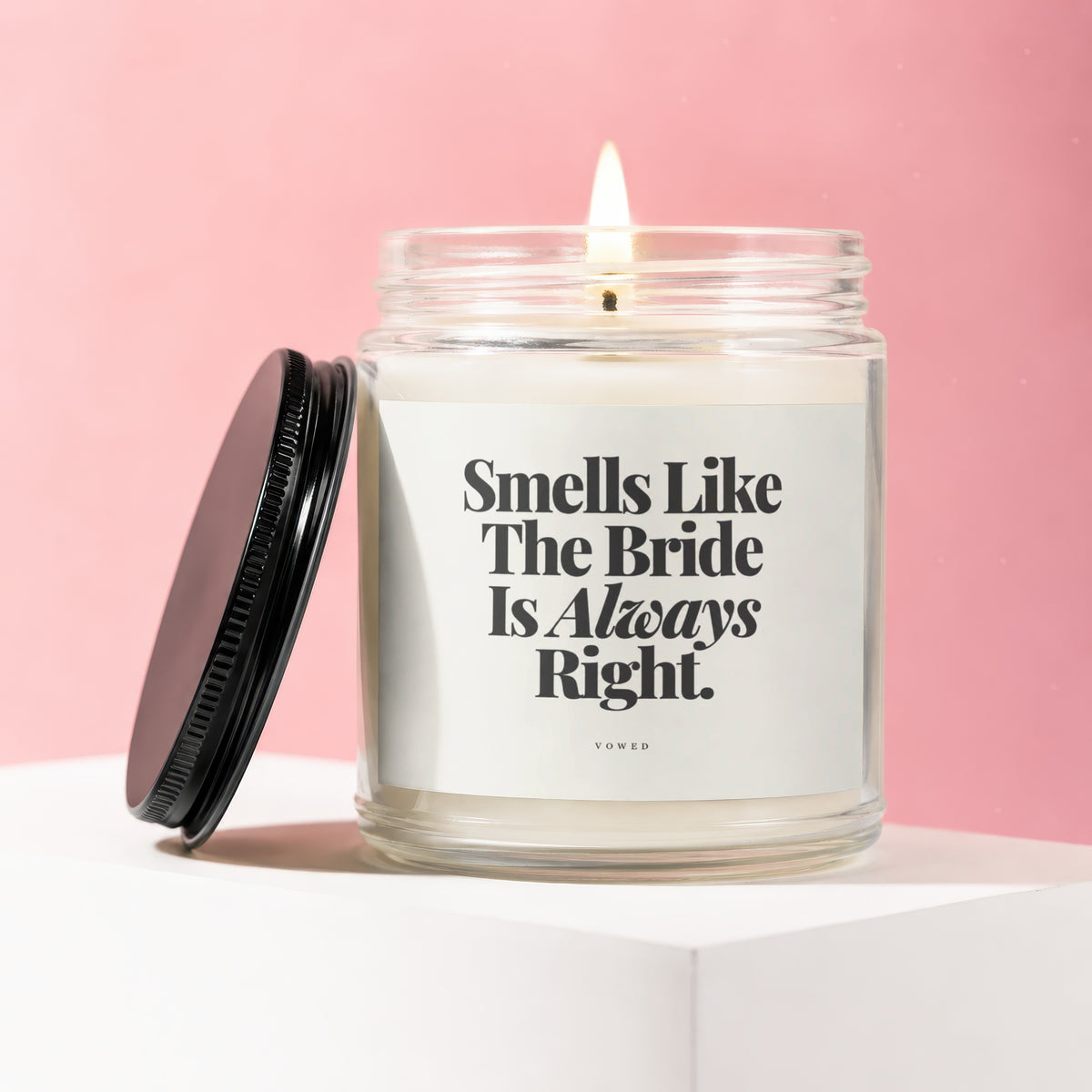 Candle in glass jar with black lid, reads "Smells Like The Bride Is Always Right."
