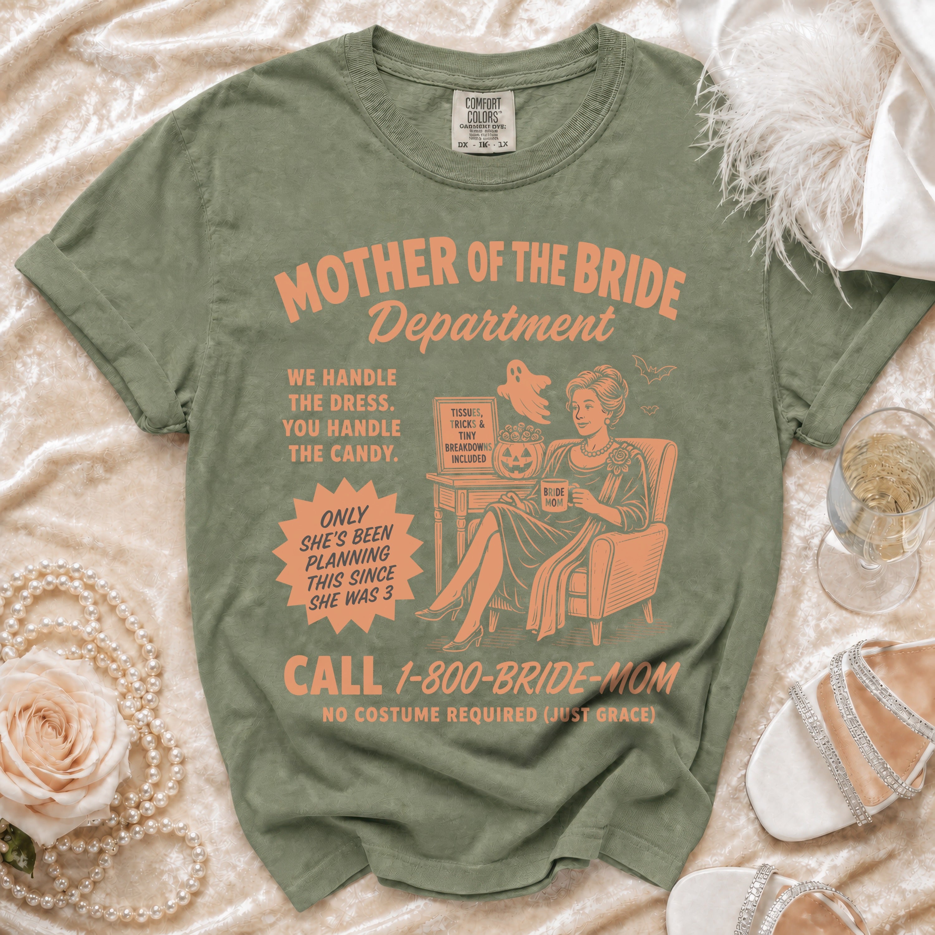 Green t-shirt with "Mother of the Bride Department" and bridal humor graphics.