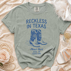 T-shirt with cowboy boots and "Reckless in Texas" text, Austin TX Summer 2026.