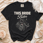 Black t-shirt with "THIS BRIDE Bites" text and vampire wedding graphic.